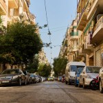 Parking space problem in a beautiful, narrow street in Athens, Vertical