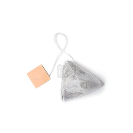 Photo for Pyramid shaped tea bag with label isolated on white background top view. - Royalty Free Image