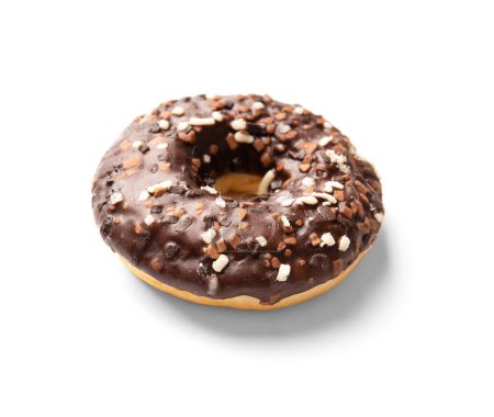 Photo for One donut in chocolate glaze sprinkled with pieces of white, milk and dark chocolate isolated on a white background. High-calorie junk food. Sweet snack. Baking for breakfast. - Royalty Free Image