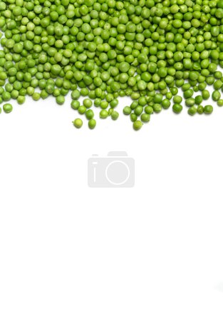 Photo for Fresh green peas are scattered on a white background, top view, copy space. Shelled grains of organic green peas on a white background. Vegetable protein, healthy products. - Royalty Free Image