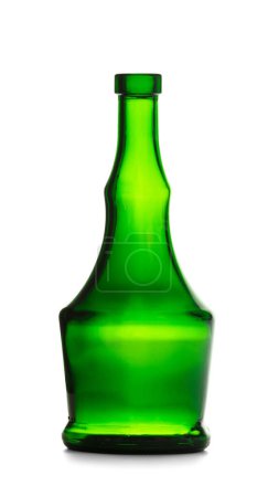 Photo for An empty bottle for alcoholic beverages made of dark green glass of a beautiful unusual shape, isolated on a white background. Bottle for cognac, whiskey, brandy. - Royalty Free Image