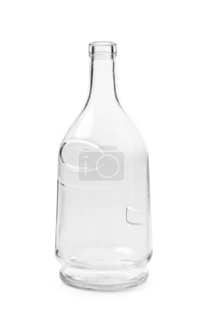 Foto de Una botella vacía para bebidas alcohólicas hecha de vidrio transparente de una hermosa forma inusual, aislada sobre un fondo blanco. Botella para coñac, whisky, brandy. - Imagen libre de derechos