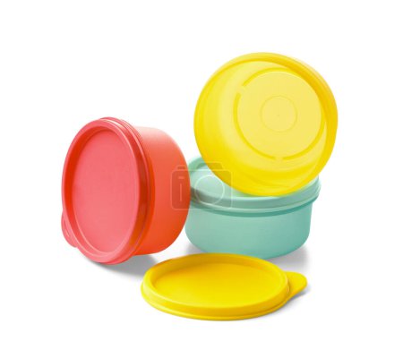 Photo for Multi-colored plastic food containers with sealed lids on a white background. Eco-plastic utensils for long-term food storage. - Royalty Free Image