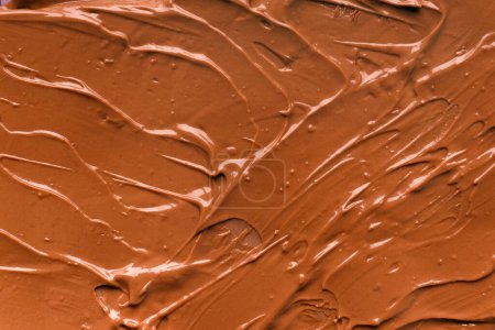 Foto de Chocolate background. Melted chocolate. Liquid milk chocolate. Handmade chocolate. - Imagen libre de derechos
