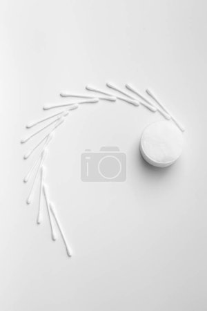 Photo for Composition from cotton swabs buds and cotton pads on a white background. The concept of personal hygiene, medicine, makeup, cleansing, skin care. - Royalty Free Image