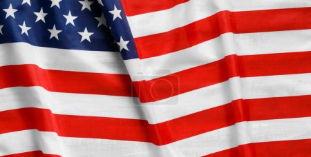 Photo for A star-striped American flag waving in the wind. The pride of the American people. Symbol of independence and patriotism in the United States. - Royalty Free Image