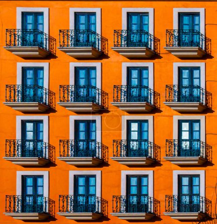 Photo for Orange facade with balconies. - Royalty Free Image
