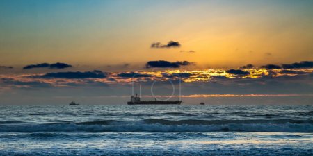 Photo for Freighter and sunset off the coast of Baja California - Royalty Free Image