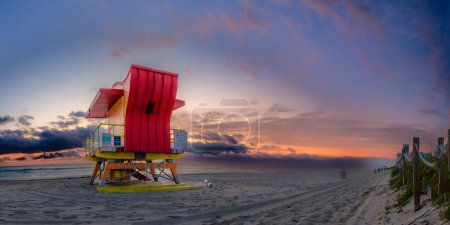 Photo for Lifeguard tower at sunrise, colorful sky background. - Royalty Free Image