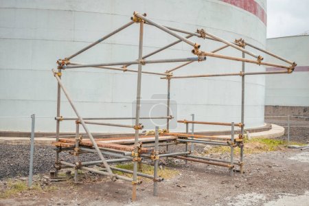 Power plant project activity for scafolding frame shelter. The photo is suitable to use for industry background, construction poster and safety content media.