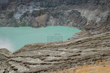 Photo for Mount Ijen Volcanic Crater blue fire and lake when day time. The photo is suitable to use for adventure content media, nature poster and forest background. - Royalty Free Image