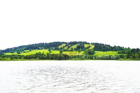 Photo for Gruentensee in the Allgau in Bavaria. View of the lake with the surrounding landscape near Nesselwang. - Royalty Free Image