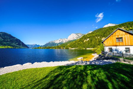 Photo for View of the Grundlsee and the surrounding landscape. Idyllic nature by the lake in Styria in Austria. Mountain lake at the Totes Gebirge in the Salzkammergut. - Royalty Free Image