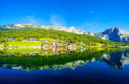 Photo for View of the Grundlsee and the surrounding landscape. Idyllic nature by the lake in Styria in Austria. Mountain lake at the Totes Gebirge in the Salzkammergut. - Royalty Free Image