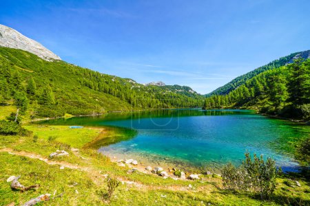 Photo for Steirersee on the high plateau of the Tauplitzalm. View of the lake at the Totes Gebirge in Styria. Idyllic landscape with mountains and a lake on the Tauplitz in Austria. - Royalty Free Image