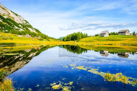 Photo for Tauplitzsee on the high plateau of the Tauplitzalm. View of the lake at the Totes Gebirge in Styria. Idyllic landscape by the lake on the Tauplitz in Austria. - Royalty Free Image