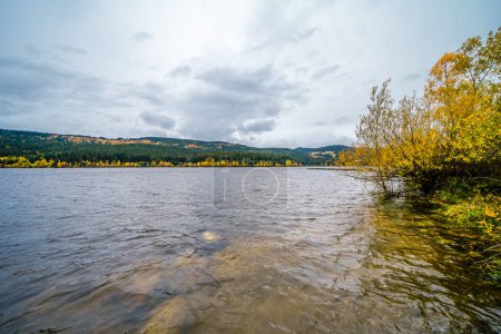 Photo for View of the Schluchsee in the Black Forest with the surrounding landscape. Nature by the lake in autumn. - Royalty Free Image