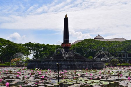Foto de View of Malang Tugu Square with beautiful garden Lotus Flower park is located in front of City Hall (Balai Kota Malang). - Imagen libre de derechos