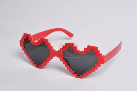 Red love pixel glasses on white background. For a birthday, disco party, carnival, festival