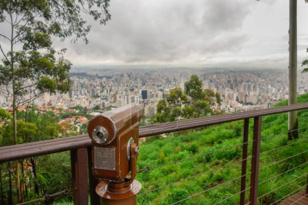 Photo for Telescope at Mangabeiras viewpoint overlooking the city of Belo Horizonte, Minas Gerais, at cloudy day. - Royalty Free Image