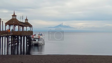 Frutillar Bajo, Chile: pier and bay of city with Osorno volcano on background.