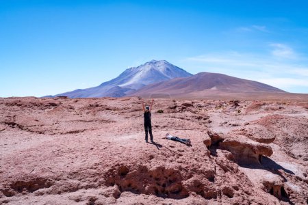 Photo for Young girl in volcanic landscape in the bolivian altiplano. High quality photo - Royalty Free Image
