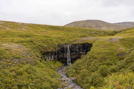 Photo for Icelandic landscape with waterfall in the centre - Royalty Free Image