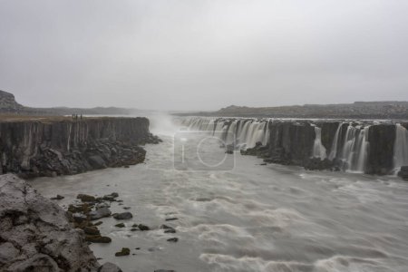 Photo for A large waterfall over a body of water - Royalty Free Image