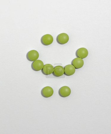 Photo for Bipolar disorder symbol made with green pills - Royalty Free Image