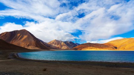 Photo for Panorama landscape of Pangong lake with mountain background under winter blue sky.Pangong tso with cloudy sky.Natural beauty of Ladakh,India. Famous tourist place in the world.China and India border. - Royalty Free Image