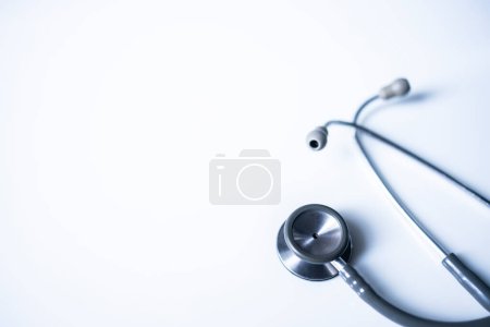 Photo for Panorama of medical stethoscope on white blur background with copy space inside hospital.Close up photo of tool for doctor or veterinary use.Beautiful clipboard for text.Clean ear piece and tube. - Royalty Free Image