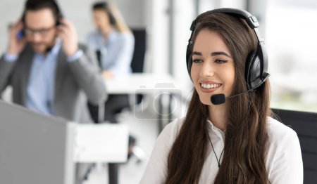 Photo for Close up portrait of friendly smiling customer support operator female working at helpdesk office - Royalty Free Image