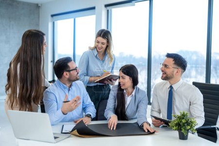 Photo for Group of engineers working together in an office, discussing and planning a project during a meeting - Royalty Free Image