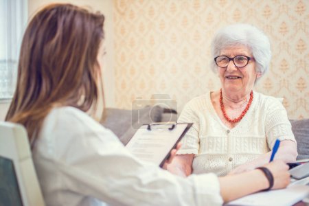 Senior woman is visited by her healthcare worker at home