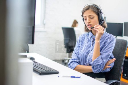 Photo for Call center agent consulting client online. - Royalty Free Image