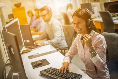 Photo for Friendly Call center smiling operator woman with phone headset. Business, communication, technology and call center concept. - Royalty Free Image