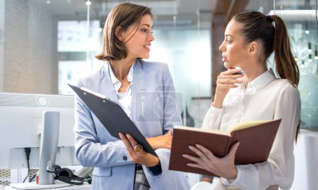 Photo for Business women arguing about documents in a office. - Royalty Free Image