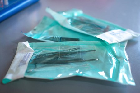 Close up of dental tools for surgical use packed in a protective foil.
