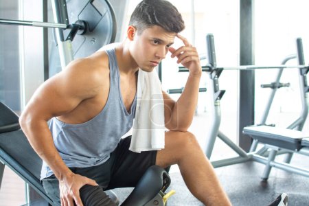 Photo for Fit man taking a break from working out at the gym - Royalty Free Image