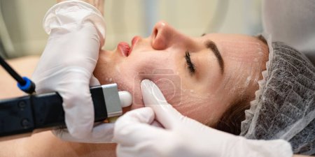Photo for Close up of beautiful young woman getting rejuvenation treatment in beauty salon - Royalty Free Image