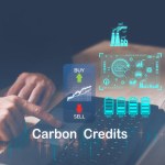 Trader using computer laptop to trade carbon credit on application. Net zero emission, Clean technology, Renewable energy concept, carbon ETF to invest in sustainable business. green climate funds
