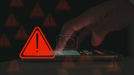risk and notification error and maintenance concept, user using smartphone with triangle caution warning sign, hacker attacks and hacking data, cyber crime, cyber security, Ransomware, Phishing