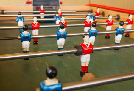 Photo for Foosball, also known as table soccer, with red and blue players. Leisure game concept - Royalty Free Image