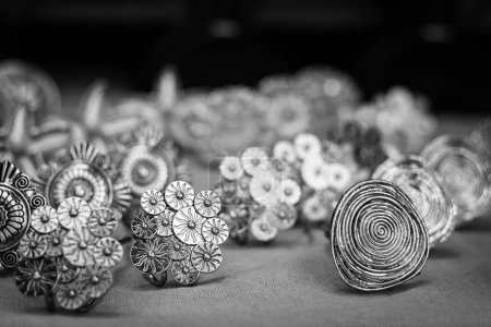 Photo for Handmade silver brooches stand on street market. Original jewelry concept. Black and white - Royalty Free Image