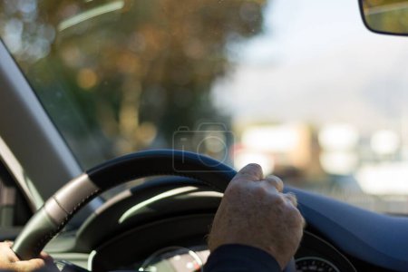 Photo for Hands of man holding steering wheel while driving sports car. Transportation, insurance concept - Royalty Free Image