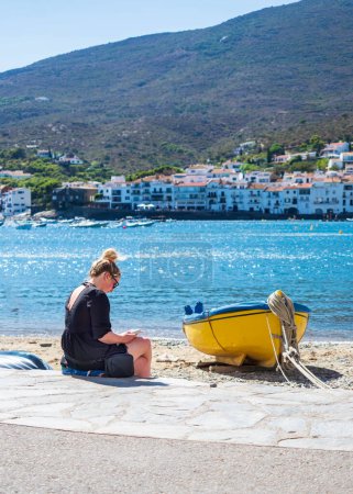 Young girl enjoying the scenery of Cadaques on a sunny day.
