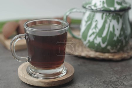 Photo for Traditional Javanese tea served with palm sugar for a sweet, creamy flavor. Enjoy the authentic taste of Indonesia in every sip. Closeup - Royalty Free Image