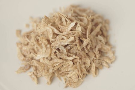 Photo for Udang Rebon or Dried Small shrimp. These small shrimp are carefully dried to intensify their unique taste and aroma, making them perfect for soups, stews, and stir-fries. - Royalty Free Image