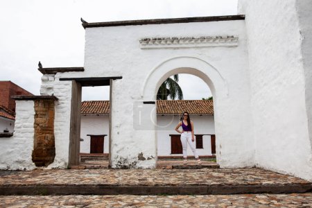 Téléchargez les photos : Beautiful young woman at the historical La Merced Church located in the Cali city downtown in Colombia - en image libre de droit