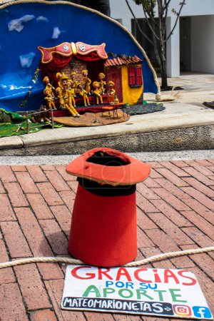 Photo for Bogota, Colombia - July 2nd 2023. Skilled puppeteer performing in the streets of the city center of Bogota - Royalty Free Image
